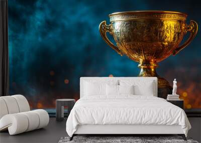 Golden trophy on dark background with copy space, stock photo style. Golden shiny winner cup award for success and achievement in business or sports competition concept.  Wall mural