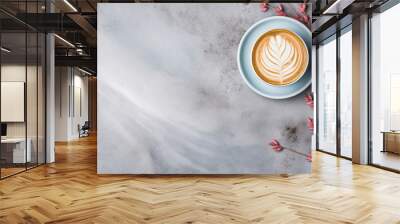 Light blue cup of cappuccino from above with latte art, dried pink leaves and grasses, on a slate stone, coffee beans, isolated on a white background. Wall mural