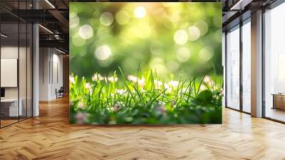 A fresh spring sunny garden background of green grass and blurred foliage bokeh Wall mural