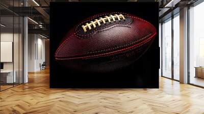 American football ball close up on black background.  Wall mural