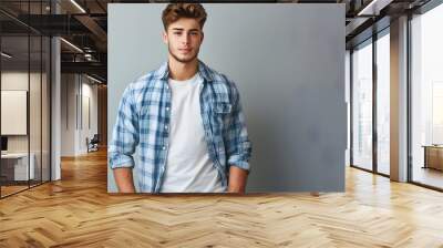 Handsome young man dressed in casual clothing.  Wall mural