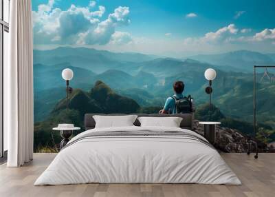 Tourist man hiker on top of the mountain. Active life concept.  Wall mural