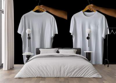 hand holding hanger plain t-shirts for mockup design. blank t-shirts from the front and back view isolated background Wall mural