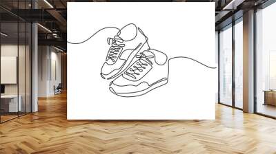 Sneakers sports shoes in a continuous one line drawing Wall mural