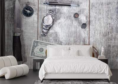 Men's items and accessories lie on a light wooden background Wall mural