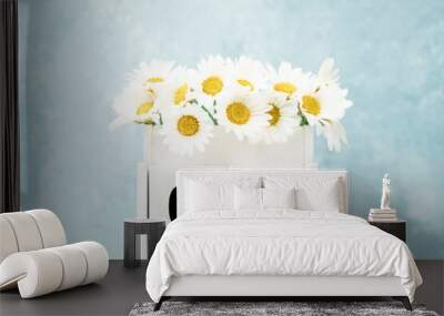 cube calendar for June with daisy flowers over blue with copy space Wall mural