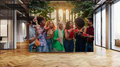 Friends enjoying watermelon on summer day Wall mural