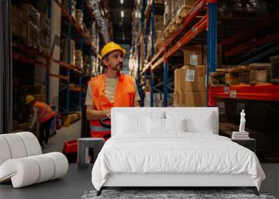 Logistics and transport worker in a warehouse Wall mural