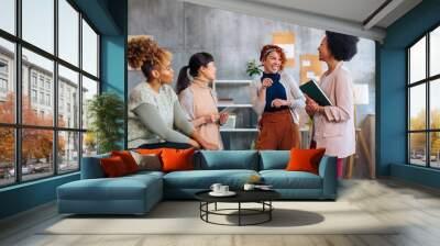 Startup business team of three young women joking together. Wall mural