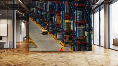 Warehouse worker checking stock inventory via technology Wall mural