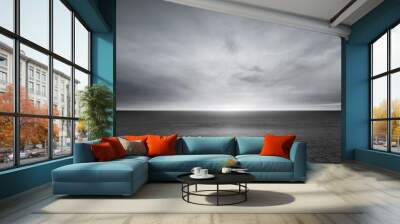 Dark Concrete Floor Background and Dramatic Gray Sky Clouds Horizon Wall mural