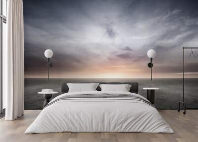 Dark Concrete Floor Background with Dramatic Sky Clouds and Sunset Horizon Wall mural