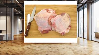 Knife and turkey thighs on cutting board Wall mural