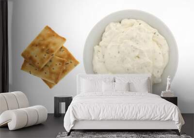 Seasoned rosemary and olive oil crackers with a bowl of French onion dip top view isolated on a white background. Wall mural