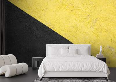 yellow and black painted wall. divided in two parts by a vertical line. urban background. copy space. industrial style. Wall mural