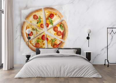 margherita pizza cut into slices on a white stone marble table Wall mural