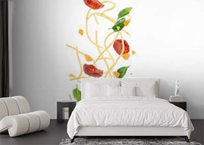 Pasta with tomatoes and basil falling into a plate, levitation. Wall mural