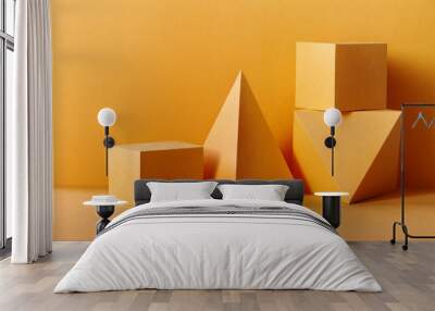 Yellow geometrical figures still life composition. Three-dimensional prism pyramid rectangular cube objects on yellow background. Platonic solids figures, simplicity concept Wall mural