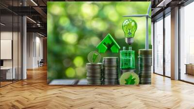 Renewable or clean energy generation costs and prices, financial concept: Green eco-friendly symbols on top of coin stacks, such as an energy-efficient light bulb, a battery, a solar panel, and a wind Wall mural