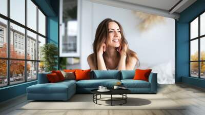 Beautiful smiling happy woman at home. Wall mural