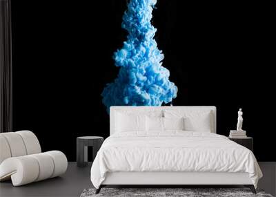 Blue ink in water on a black background. Wall mural