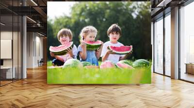 Group of happy kids eating watermelons outdoor. Wall mural