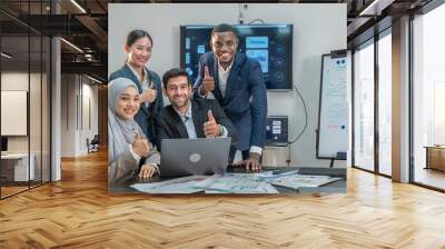 Group multiracial employee teamwork smile and hand show good thumb collaboration at happy working in office company. colleague teamwork multiethnic group looking showing good thumb in meeting room. Wall mural