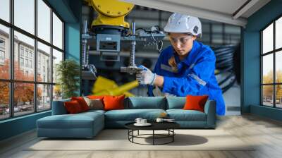 woman technician engineer check heavy machine construction installation in industrial factory. technician worker check for repair maintenance electronic operation manufacture factory plant industry	 Wall mural