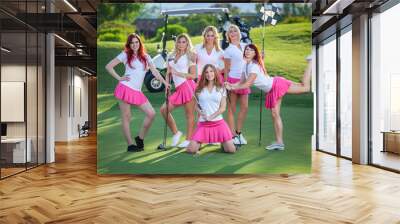 Group of young golf caddies hanging out on golf course with club Wall mural