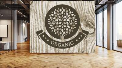 Organic product badge with tree on wooden texture. Vector illust Wall mural