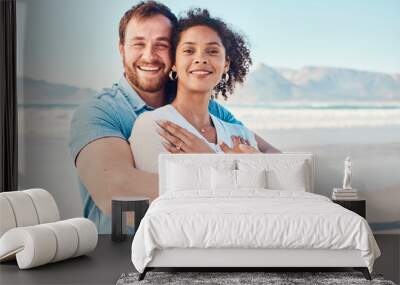 Beach, love and portrait of couple hugging in nature, holiday or romantic outdoor date together at the ocean, sea or sand. Happy, smile and people in a hug, embrace or happiness on anniversary Wall mural