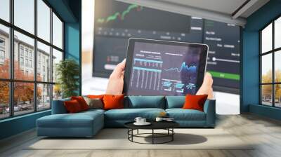 Tablet in hands, graphs and stock market with fintech and trading, investment and financial stats on dashboard. Finance information, trader person and cryptocurrency, data analysis, charts and app Wall mural