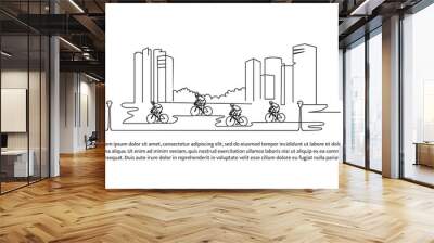 Continuous line design of cyclists cycling together in front of buildings. Sport design concept in city. Decorative elements drawn on a white background. Wall mural