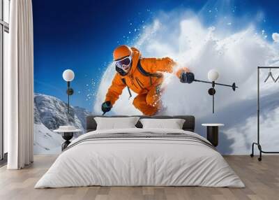 A skier on skis descends from the mountain through the snow in winter. Extreme sport. Wall mural