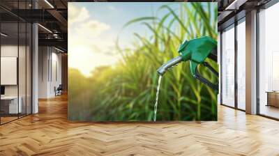 Modern and clean green ethanol fuel hose pump with sugar cane plantation in the background, poster or banner advertisement, copy space. Eco Fuel concept. Save the earth, ecology, alternative energy. Wall mural