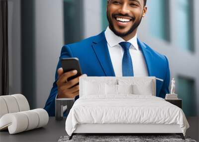 happy african american businessman holding cell phone  Wall mural