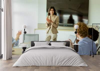 Confident businesswoman leading a strategic planning session in a modern office Wall mural