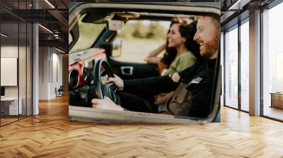 Couple having fun on roadtrip Wall mural