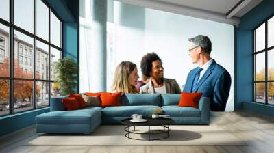 Group of business people using digital tablet at meeting in the office Wall mural