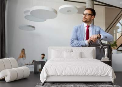 Handsome businessman leaving office Wall mural