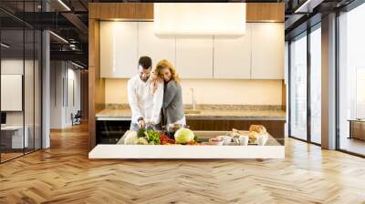 Loving couple in the modern kitchen Wall mural