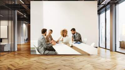 Multiethnic young business people working together in the office Wall mural