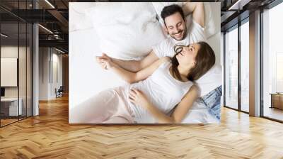 Young loving couple in the bed Wall mural