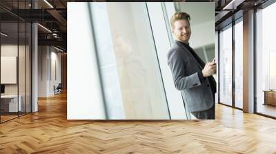 Young man in the office Wall mural