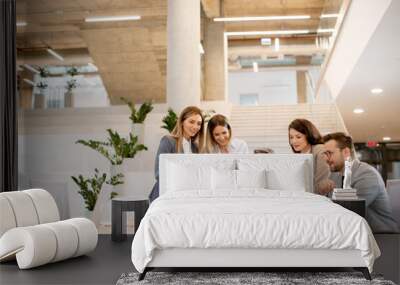 Young startup team working in the office Wall mural