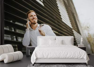 young successful men entrepreneur using mobile phone outdoor Wall mural