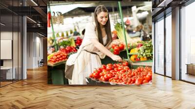 Young woman on market Wall mural