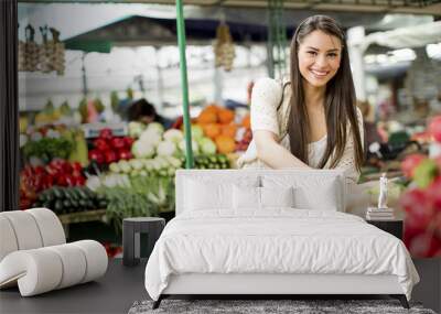 Young woman on the market Wall mural