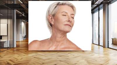 Beautiful mature caucasian woman posing topless and isolated against a pink background copyspace . Happy senior woman with glowing skin. Good skincare and a healthy routine is self care for your skin Wall mural