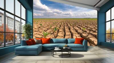 Dry Cracked Soil with Green Plants  - Drought, Climate Change, Agriculture Wall mural